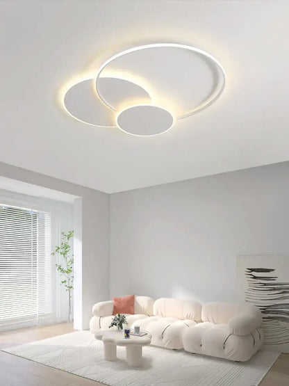 Modern white minimalist circles led ceiling light with three interlocking rings emitting warm glow for bedroom decorbites circles led
