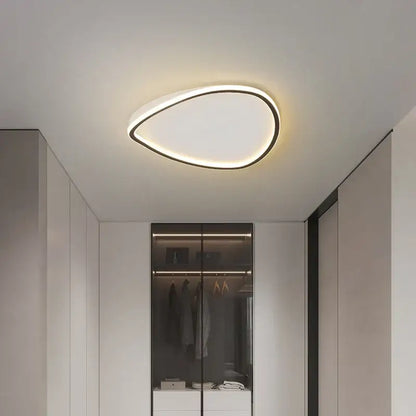 Modern white minimalist led ceiling light strip with a teardrop-shaped black frame and soft white illuminated surface
