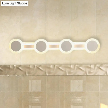 Modern white minimalist led vanity light with four circular bulbs on a sleek frame 110v-120v maximum bulb wattage