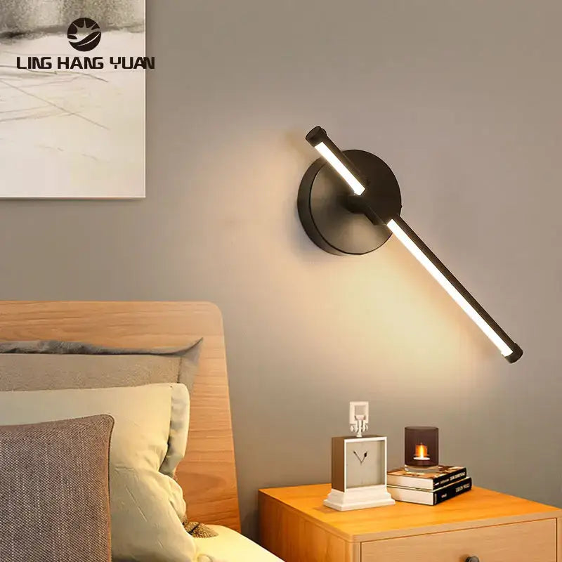 Black modern wall sconce with sleek angular design and circular base for minimalist bedroom decorbites led wall lamp