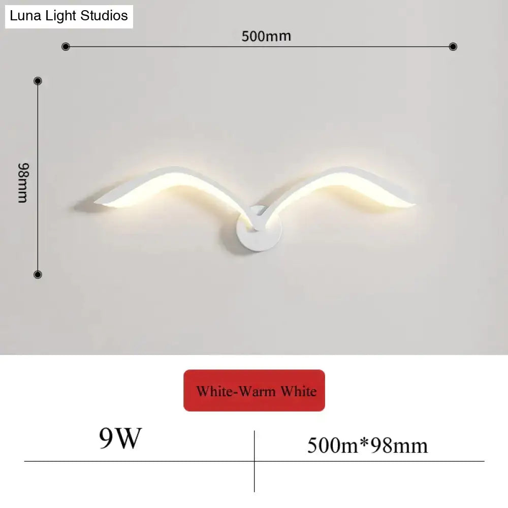 White seagull-shaped nordic avian style wall lamp with warm white light for modern indoor style bedroom use
