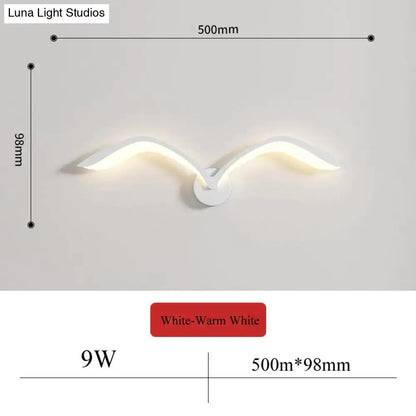 White seagull-shaped nordic avian style wall lamp with warm white light for modern indoor style bedroom use