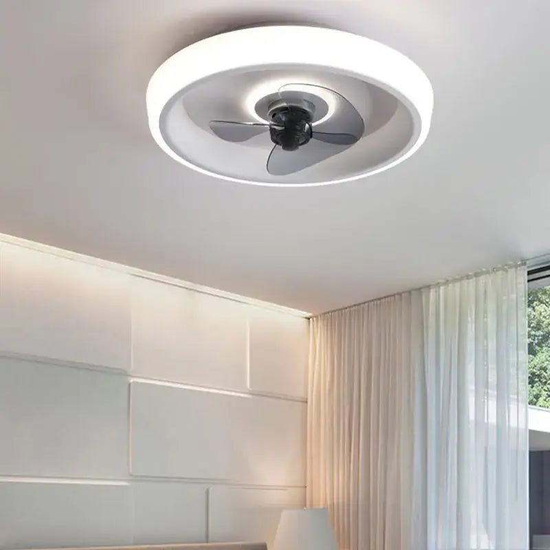 Modern white and orange circular ceiling fan light with sleek black blades and integrated led for bedroom use