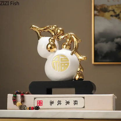 Modern white and orange golden gourd ceramic sculpture with gold accents and circular 福 character for living room decorbites decorbites golden gourd decor