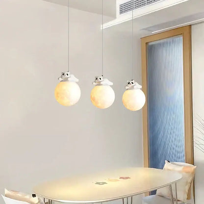 Modern white panda bear bedroom wall lamp with three hanging pendant lights featuring softly glowing spherical orbs