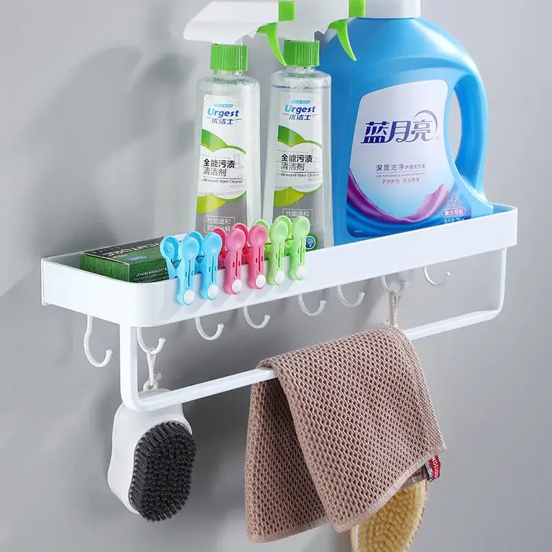 Modern white plastic corner shelf with towel bar and hooks for kitchen storage holding cleaning supplies