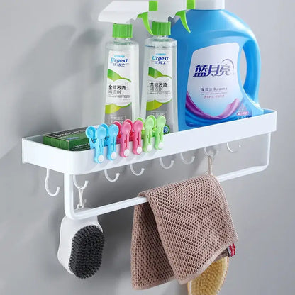 Modern white plastic corner shelf with towel bar and hooks for kitchen storage holding cleaning supplies