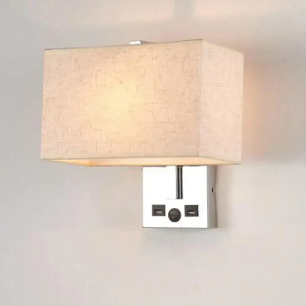 Modern rectangular wall sconce with a beige linen shade and chrome-finished base featuring integrated usb ports.