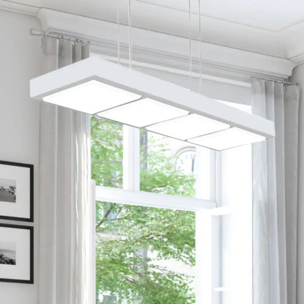 Modern white metal rectangular island lamp with four illuminated panels suspended by thin cords for office lighting