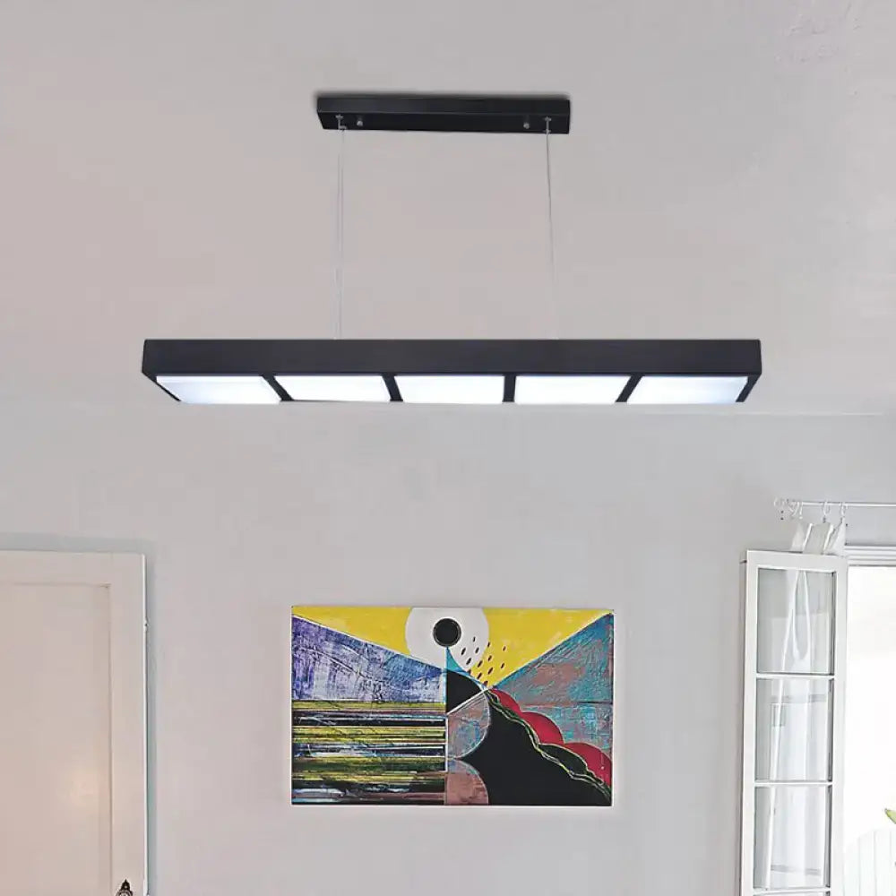 Modern black metal rectangular island lamp with four illuminated panels for office or kitchen lighting by DecorBites