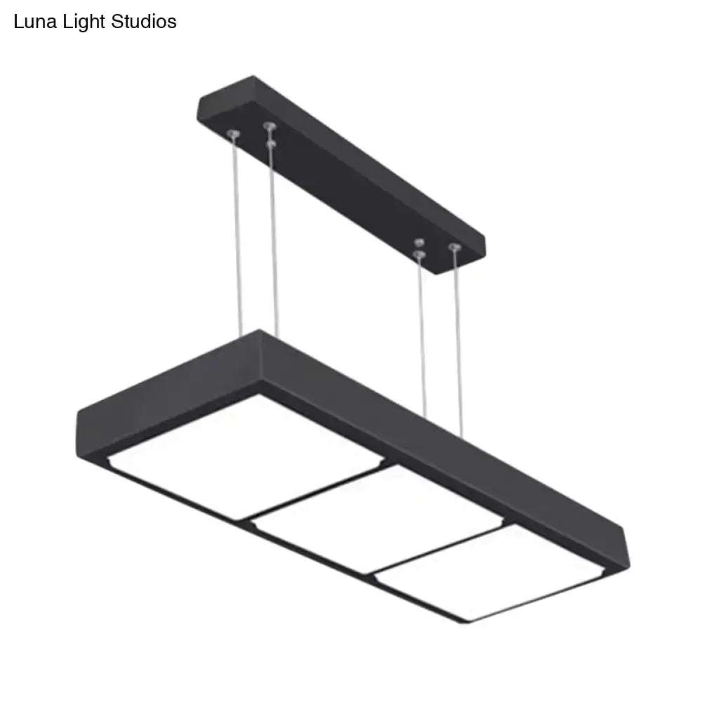 Black metal rectangular island lamp with three illuminated panels suspended by thin cables for office lighting
