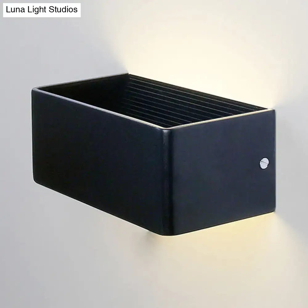 Black rectangular solar wall lamp with sleek matte finish and integrated warm white led lighting for modern interiors