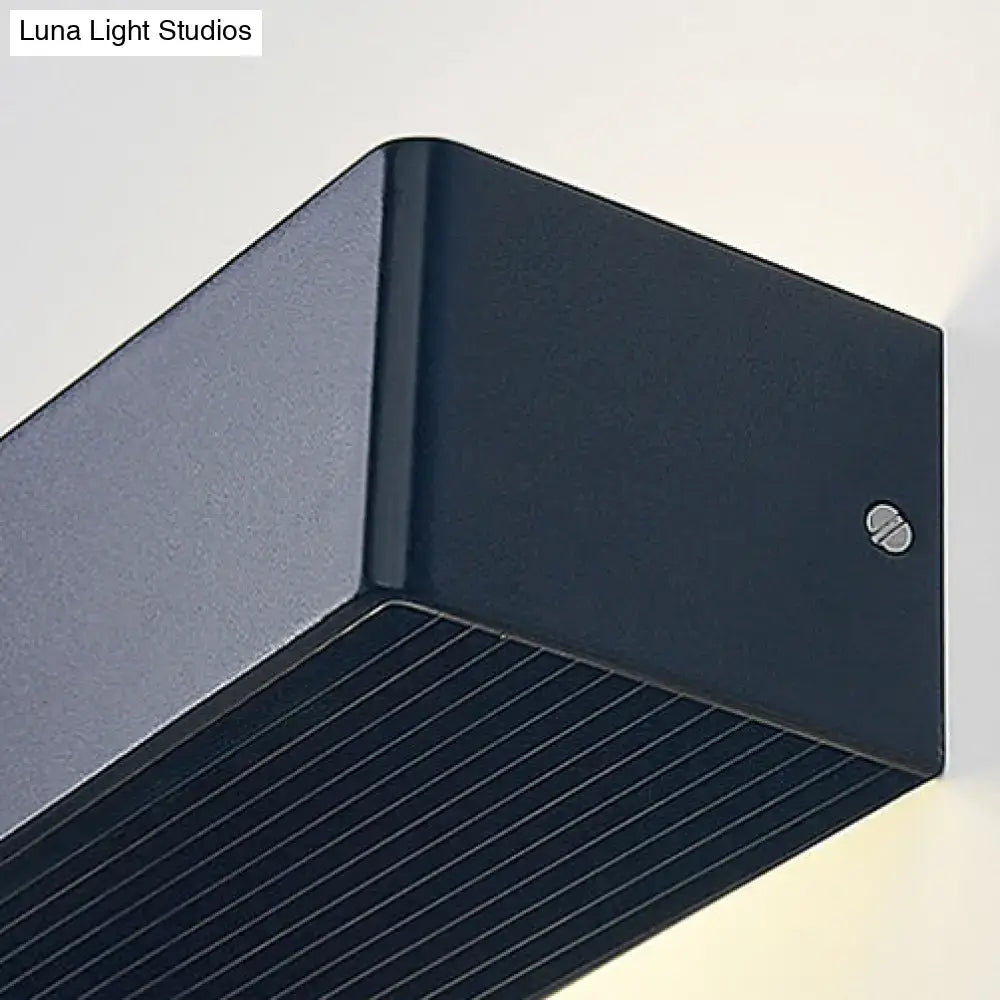 Dark blue rectangular outdoor wall lamp with matte finish and horizontal slats for warm white bedroom lighting