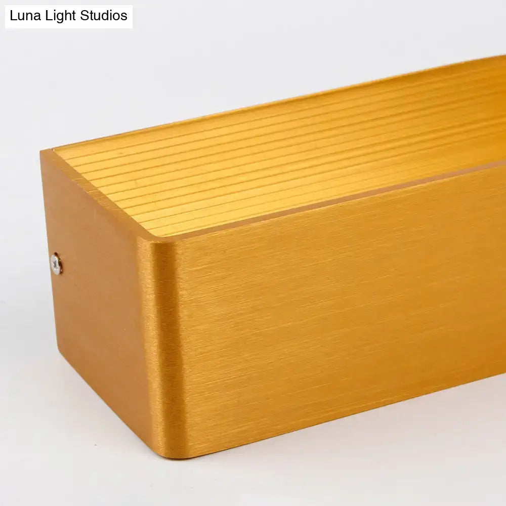 Modern white rectangular wall lamp with gold brushed metal finish and warm white light for bedroom sconce use