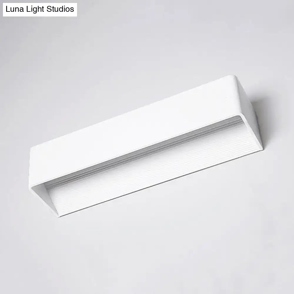 Minimalist modern white rectangular wall lamp with warm white light for bedroom featuring sleek black white design