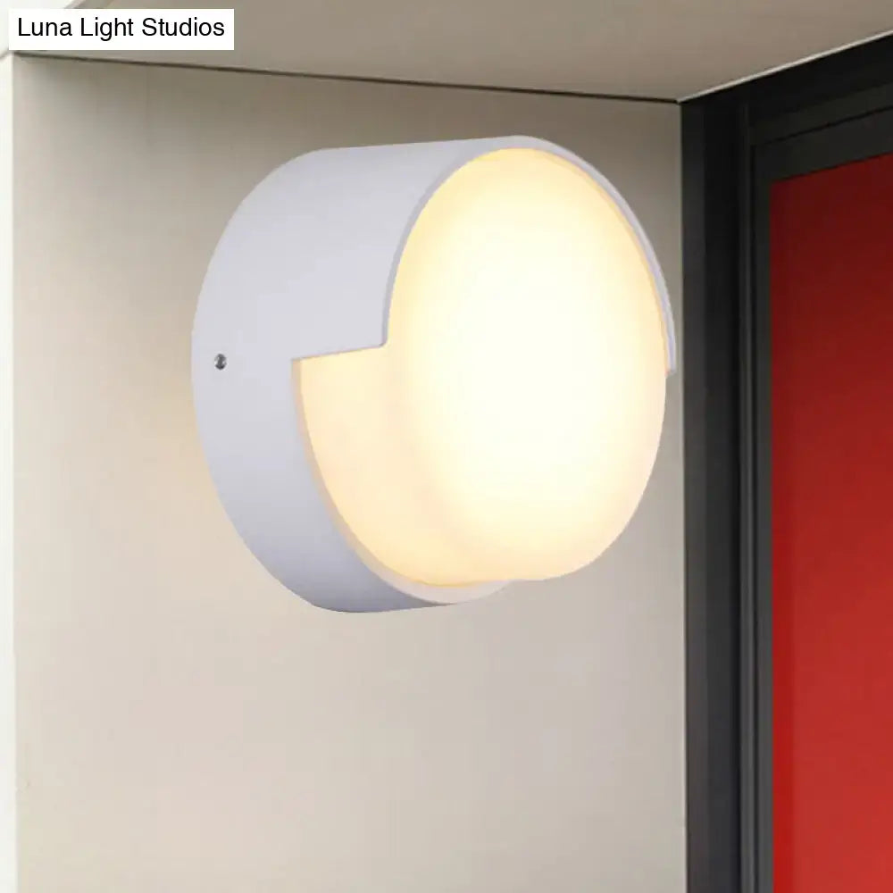 Modern white circular wall light with warm white diffused illumination for direct wired hallway installation