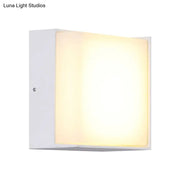 Modern white rectangular wall light with warm white diffused glow direct wired for hallway lighting