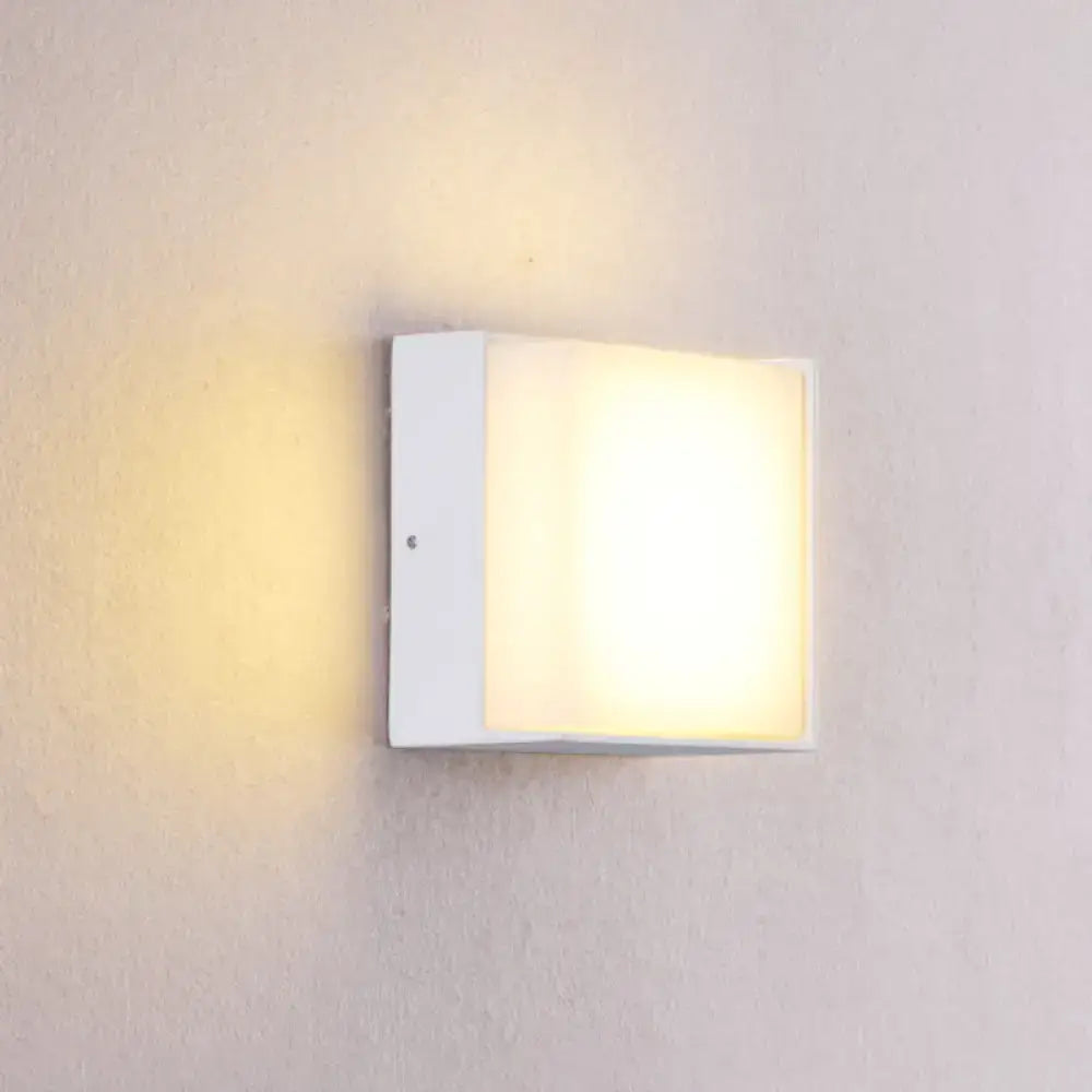 Modern white rectangular wall light with frosted glass panel emitting warm white illumination direct wired for hallway use