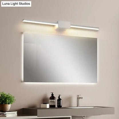 Modern white rectilinear wall sconce bathroom led mirror light with integrated led lighting above and below framed in white