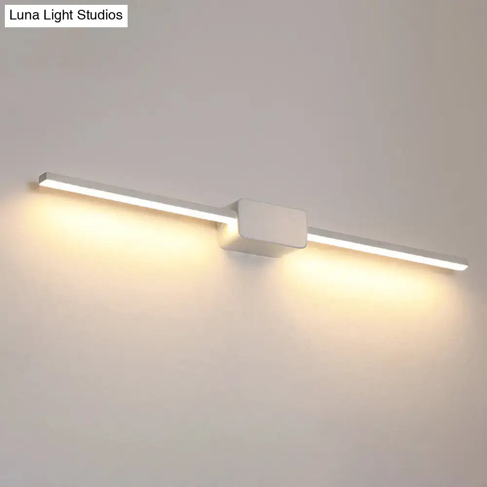 Modern white rectilinear wall sconce with sleek LED design provides warm ambient glow for bathroom mirror lighting