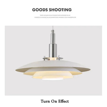 Modern white and red gradient ufo pendant light with concentric white and cream disc shades in sleek chrome fixture