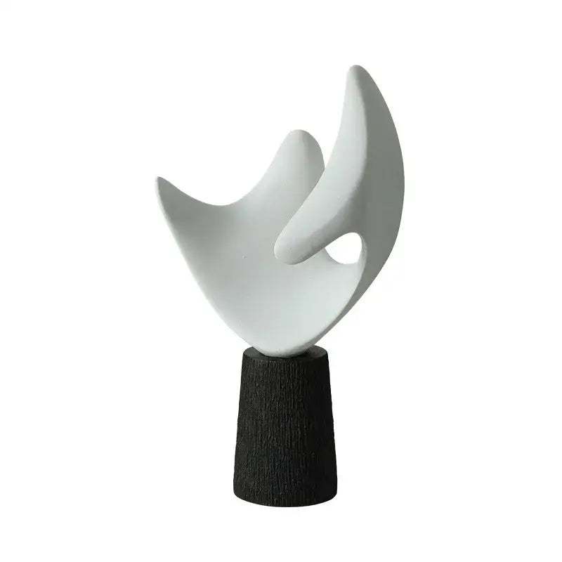 Modern white resin sculpture with smooth flowing curves on dark wooden base for living room decorbites abstract decor