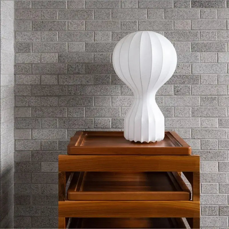 Modern white ribbed silk table lamp with sleek design for bedroom decorbites gatto cocoon silk lighting