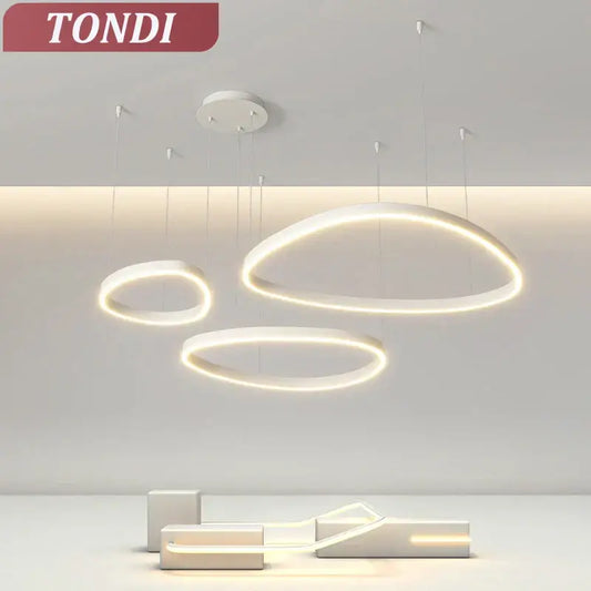 Modern white ring pendant light with led glowing edges by tondi ideal for dining room with white finish design