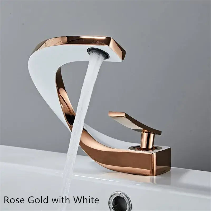 Modern white and rose gold basin faucet with elegant rose gold finish and sleek curved waterfall design