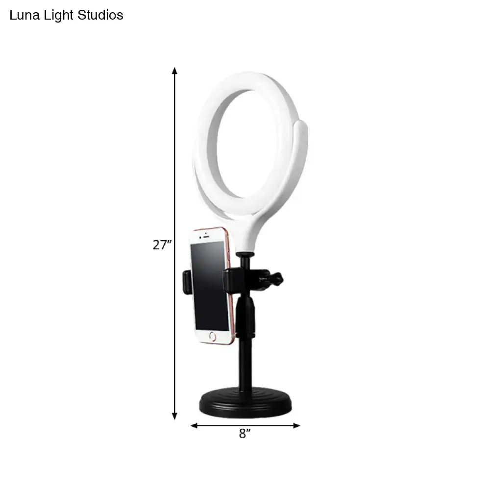 Modern white round mirror light with usb port featuring a 27 inch white ring light on black stand with phone mount