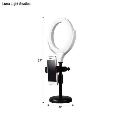 Modern white round mirror light with usb port featuring a 27 inch white ring light on black stand with phone mount