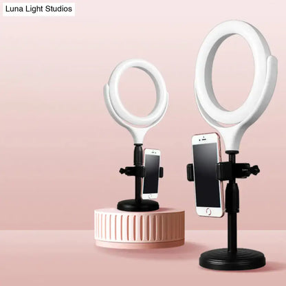 Modern white round mirror light with usb port featuring a white ring mirror light with black stand and phone holder