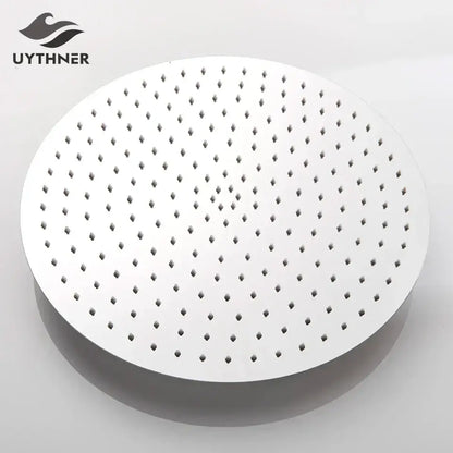 Modern white round rainfall shower head with evenly spaced perforations and sleek contemporary bathroom fixture design