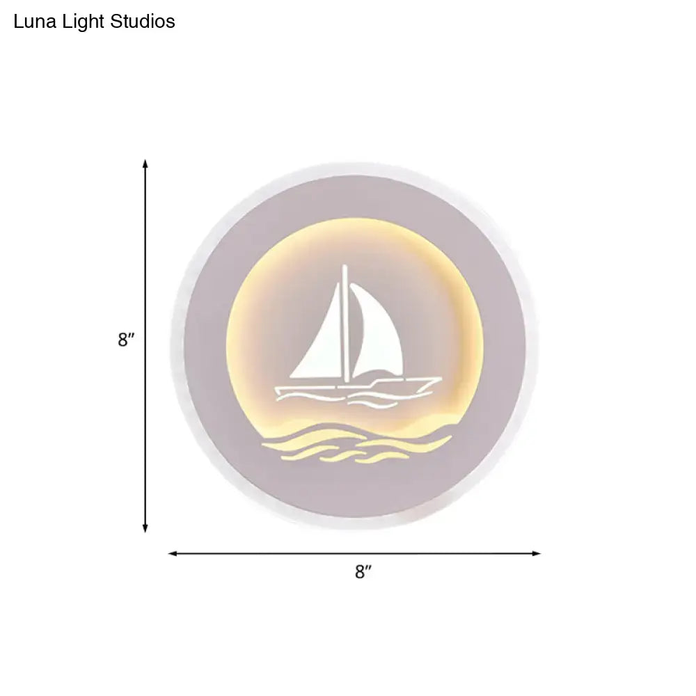 Modern white sailboat tree pattern wall light with warm yellow led sconce illumination on a soft gray background