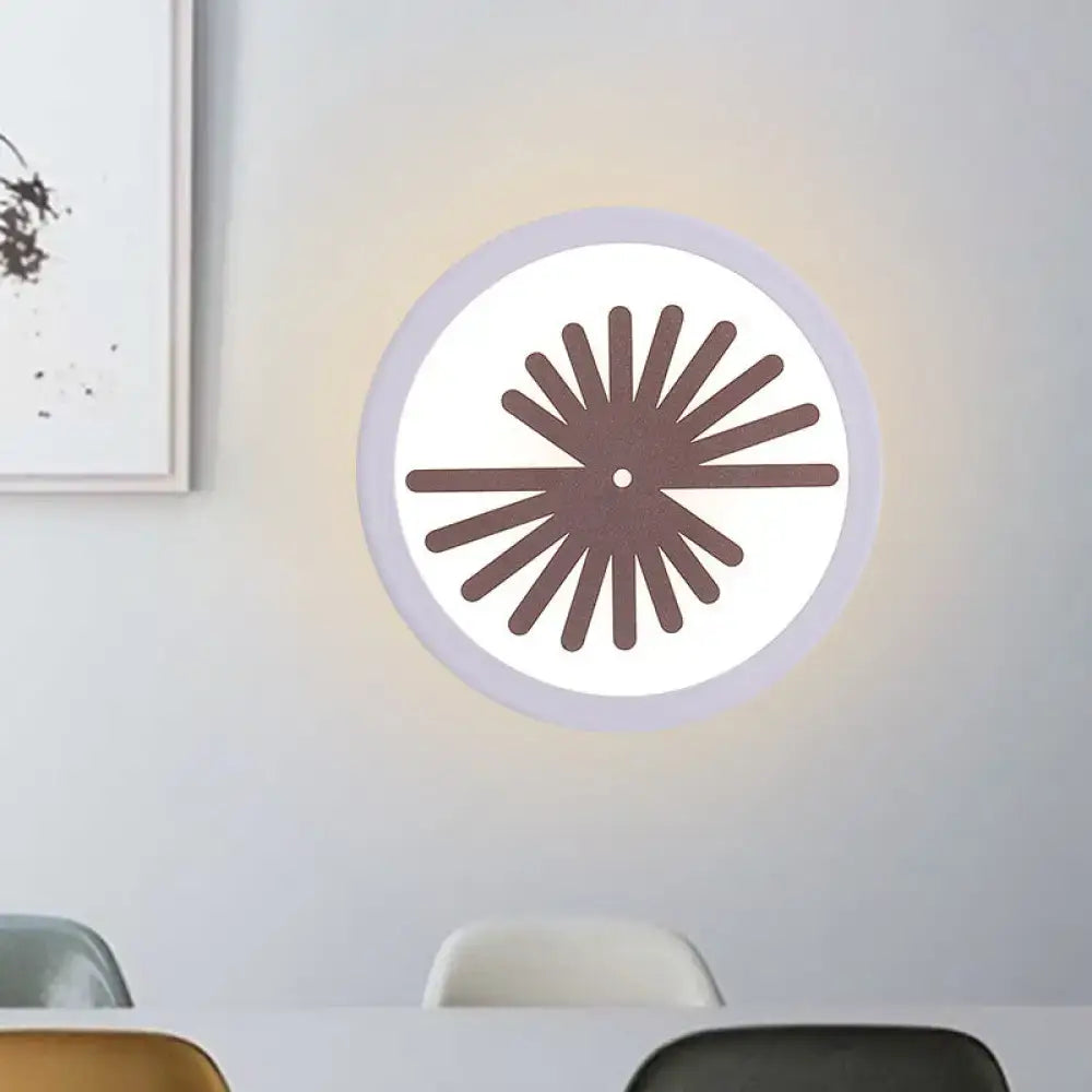 Modern white sector leaf pattern wall light with a white illuminated face and brown radial fan design for living room use