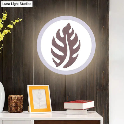 Modern white sector leaf pattern wall light with dark brown monstera leaf design for living room sconce
