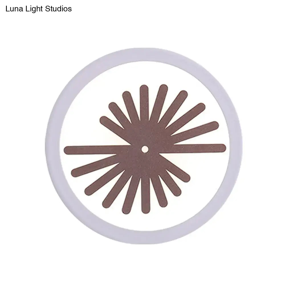Modern white sector leaf pattern wall light with brown radial metal disc and central hole in light gray frame