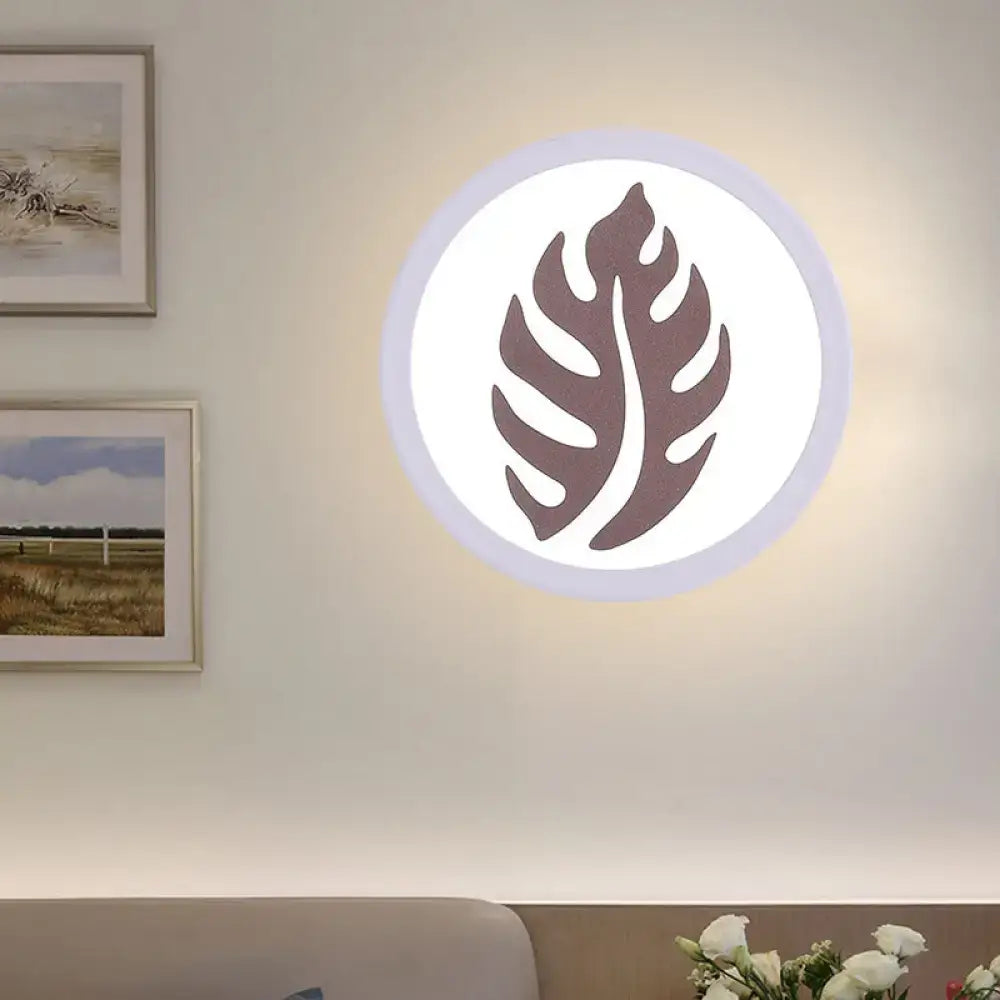 Modern white sector leaf pattern wall light with dark brown monstera leaf design for living room sconce