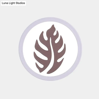 Modern white sector leaf pattern wall light with a circular brown leaf design on a white background and gray border
