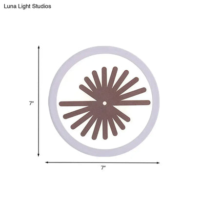 Modern white sector leaf pattern wall light with a circular white clock face and brown radial spokes for living room sconce