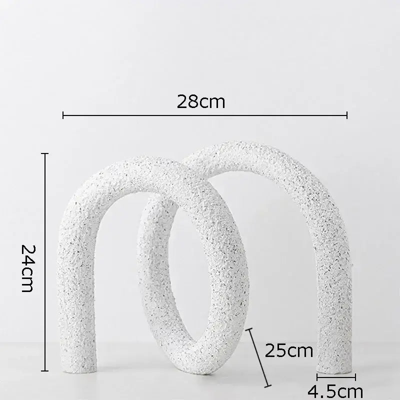 Modern white speckled ceramic abstract twisted knot sculpture with textured interlocking curved arches for living room decor