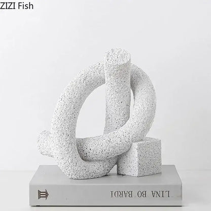 Modern white speckled abstract twisted knot sculpture in textured resin with interlocking rings and cube base for decor