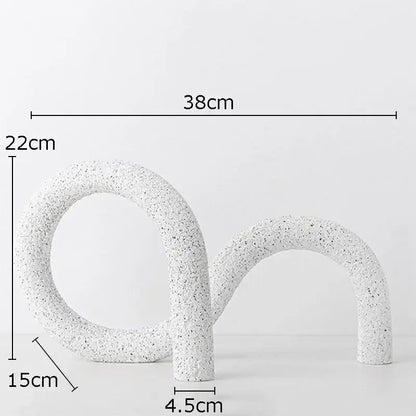 Modern white speckled resin abstract twisted knot sculpture with s-shaped design for living room decor