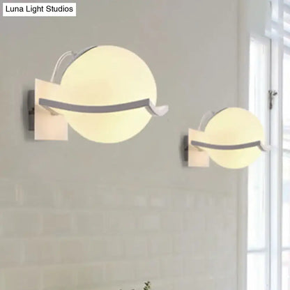 Modern white sphere opal glass wall sconce with direct wired electric and warm frosted diffuser for kitchen lighting