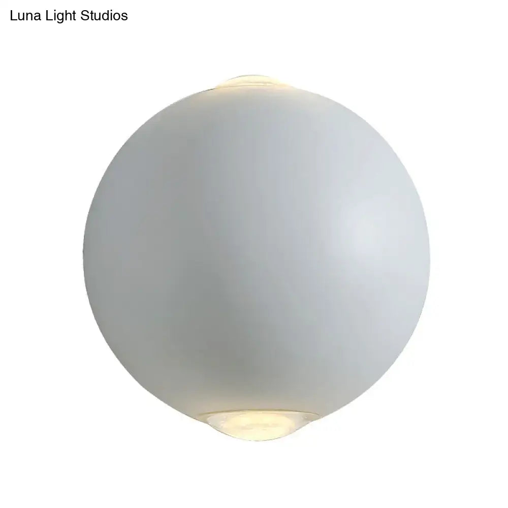 Modern white spherical wall light fixture with frosted glass and soft glow for outdoor use as an elegant wall light