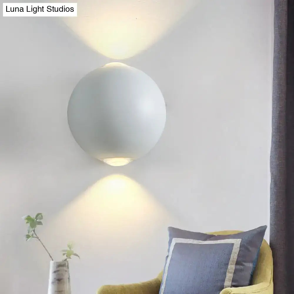 Modern white spherical wall light fixture with a sleek matte finish and minimalist design for outdoor wall light use
