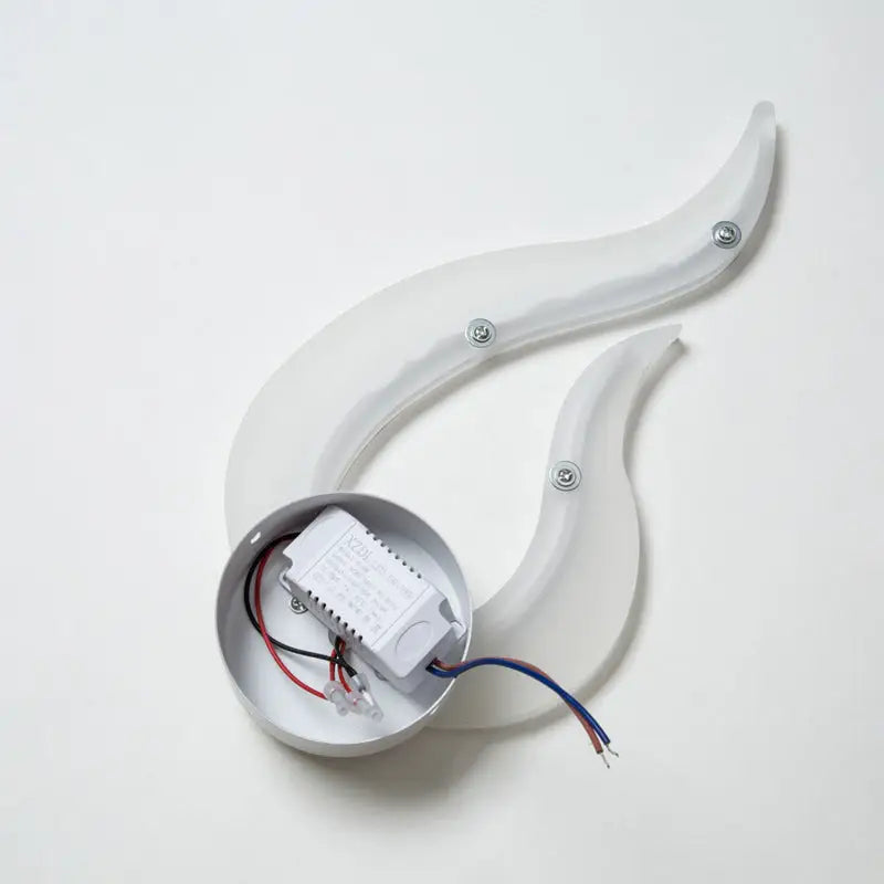 Modern white spiral led wall sconce 8 inch fixture with translucent flame-shaped light and silver mounting base with exposed wiring