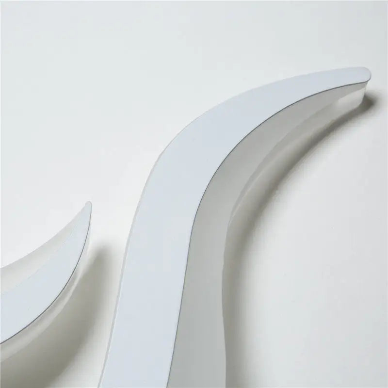 Modern white spiral led wall sconce 8 inch fixture with a sleek minimalist curved white shelf and glossy finish