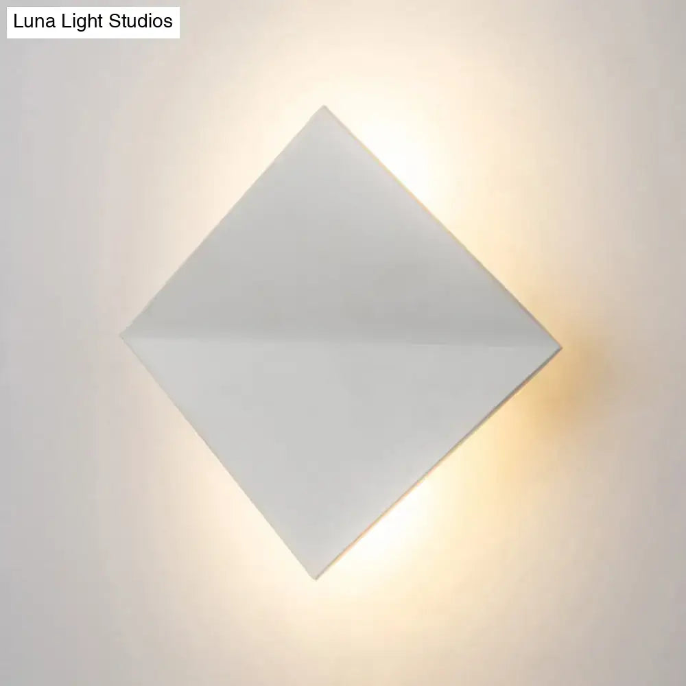 Modern white square wall sconce with a direct wired electric connection and matte finish for living space lighting