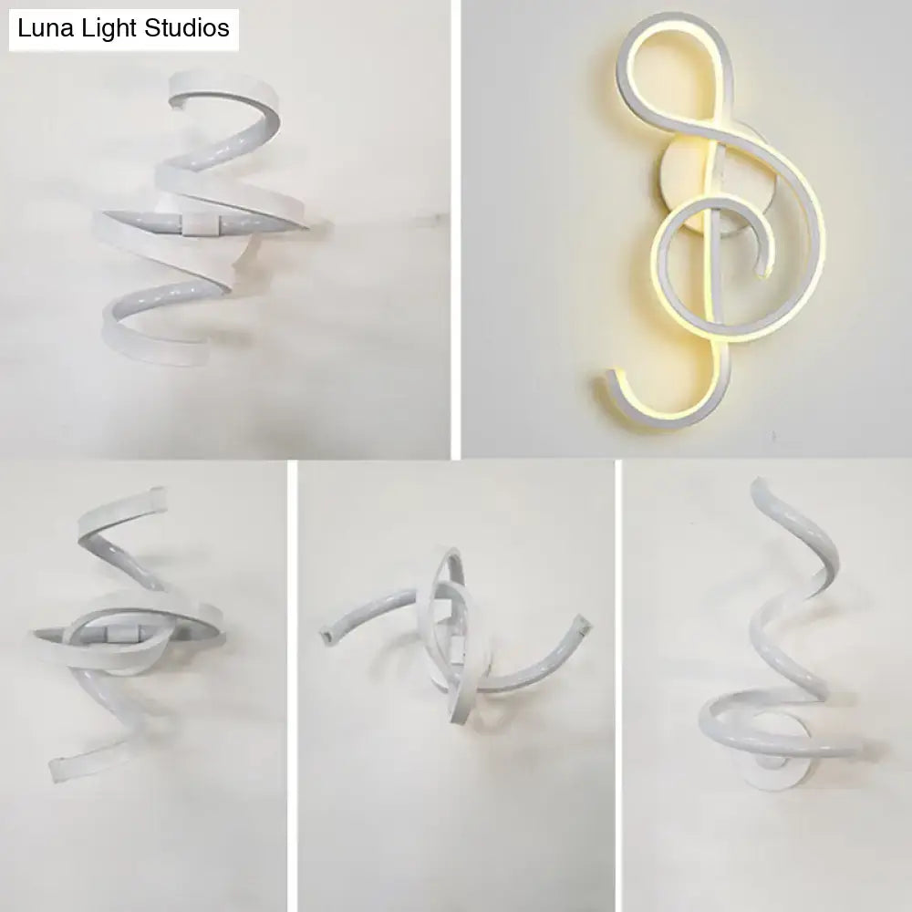 Modern white led wall sconce with a sleek spiraling design shaped as an illuminated treble clef for bedroom lighting